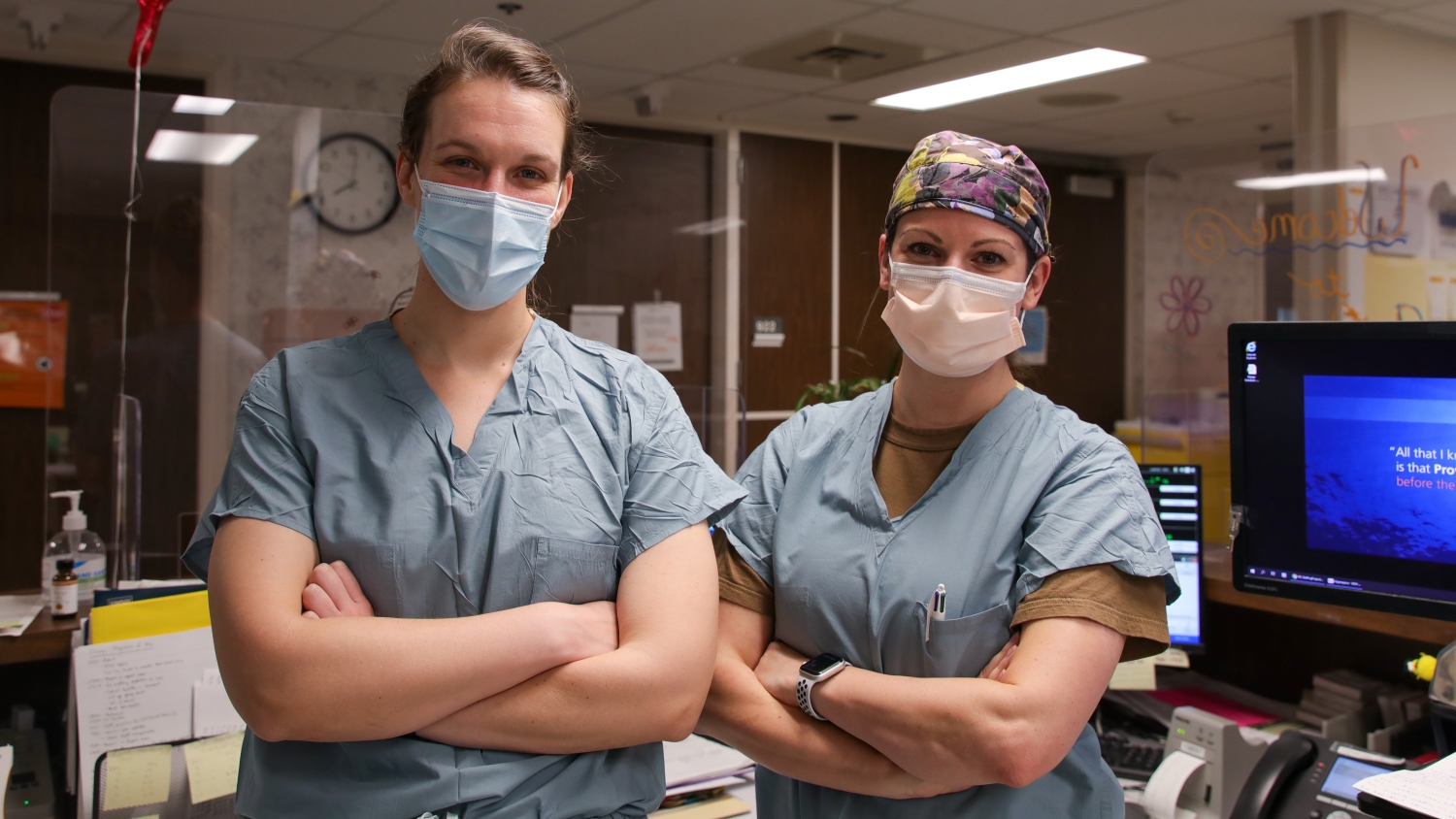 two surgeons in an outer office area at a hospital