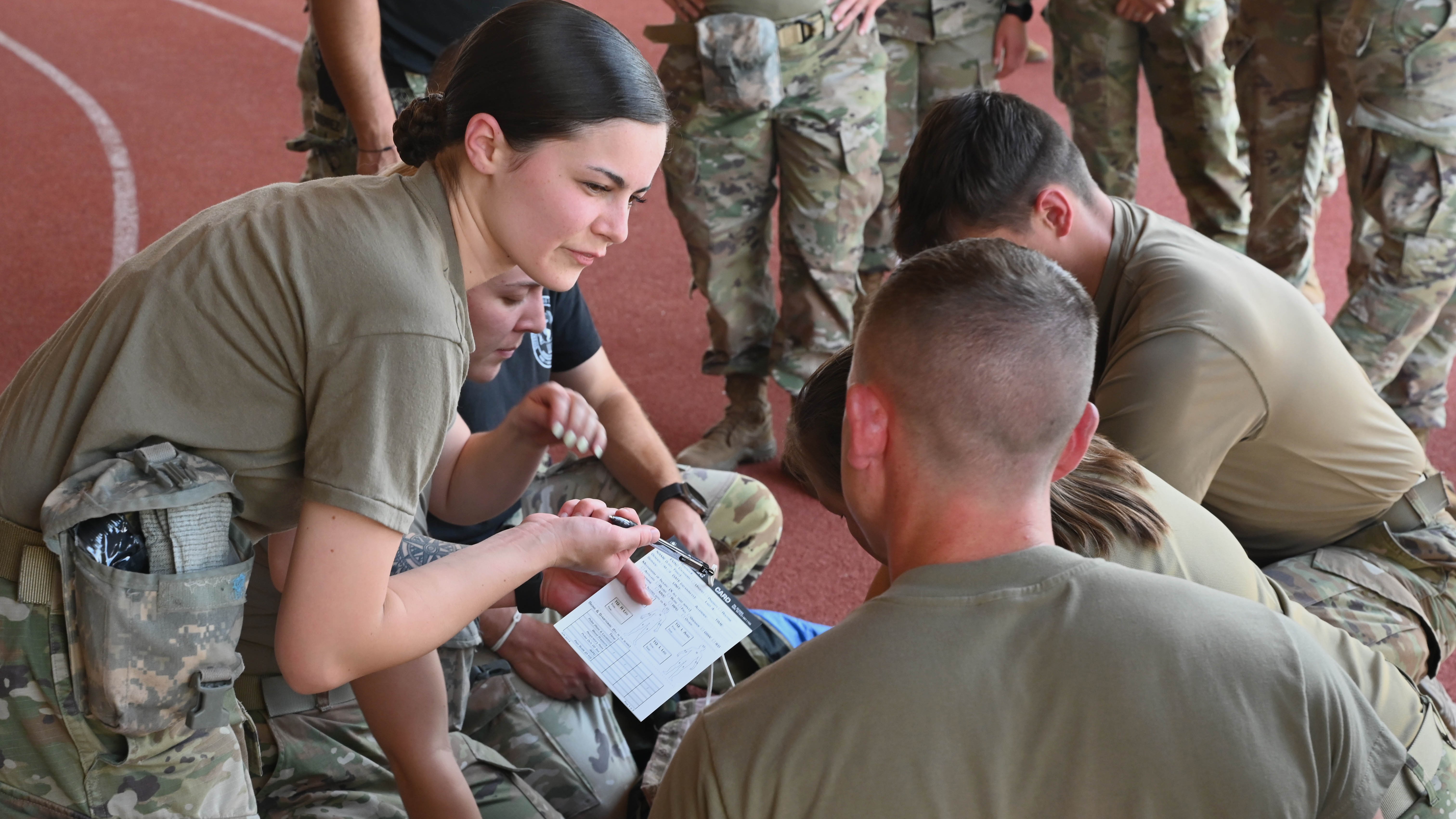 doctor speaks to trainee at military medicine training