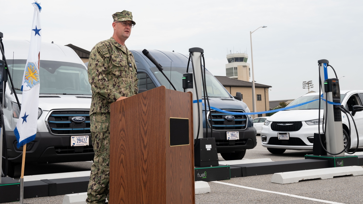 U.S. Navy Capt. Newt McKissick speaks at the unveiling of new EV chargers at Dover AFB