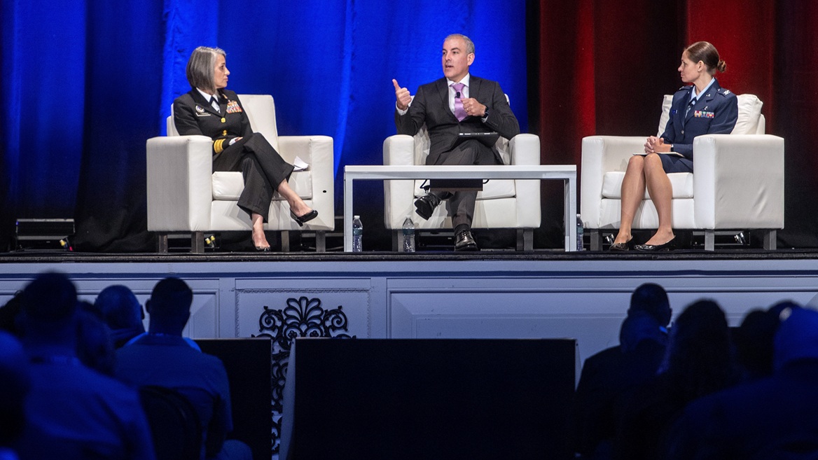 U.S. Public Health Service Rear Adm. Tracy Farrill, Military Health System electronic health record functional champion; Dr. Jesus Caban, chief data and analytics officer of the Defense Health Agency; and U.S. Air Force Col. Tara Conner, chief health informatics officer, Defense Health Agency, talk about data, informatics and the electronic health record during the opening day of the 2025 Defense Health Information Technology Symposium in Nashville, Tennessee, Aug. 26, 2025. The symposium focused on the theme, “Empowering Care, Enhancing Readiness: Harnessing Health IT Innovation.”