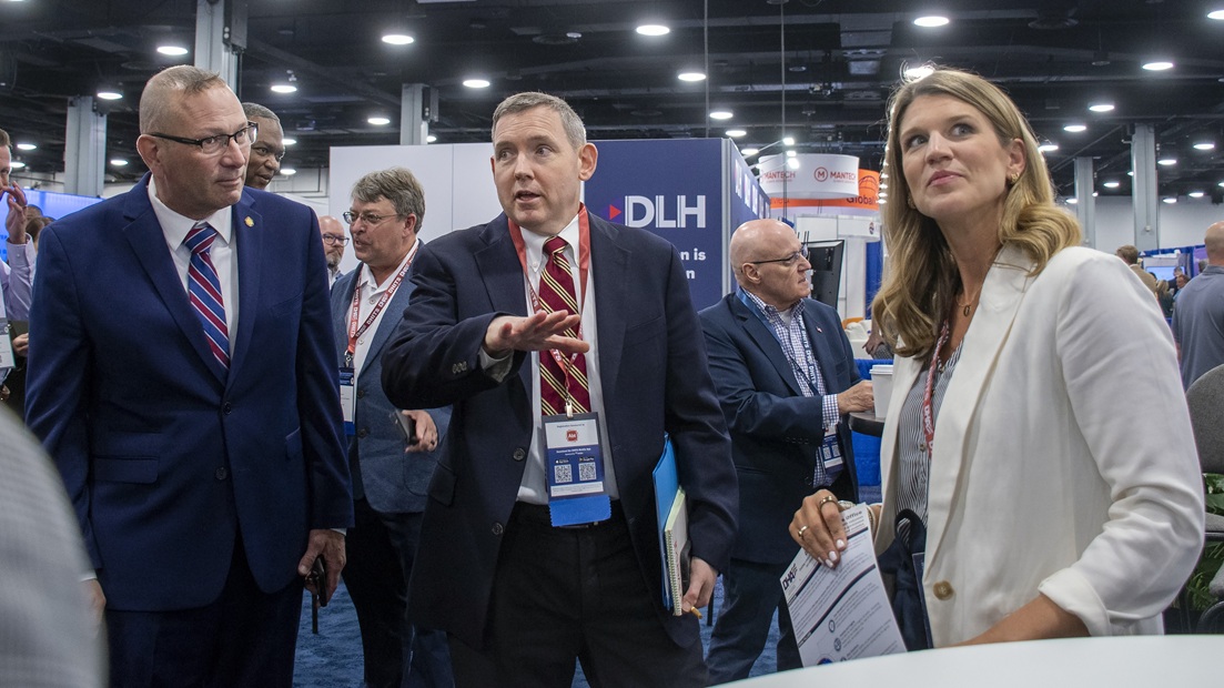 Pat Flanders, chief information officer of the Defense Health Agency, and Dr. Glen Diehl, acting deputy director of Defense Health Agency, take a tour of the exhibition hall at the 2025 Defense Health Information Technology Symposium in Nashville, Tennessee, Aug. 26, 2025. Flanders and Diehl visited the DHA pavilion and spoke with personnel representing different offices from DHA’s headquarters. The symposium focused on the theme, “Empowering Care, Enhancing Readiness: Harnessing Health IT Innovation.”