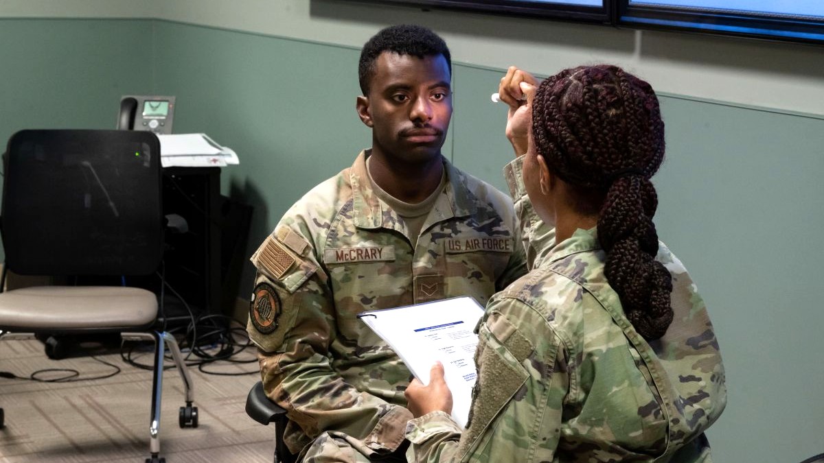 Staff Sgt. Kristin Terry, 436th Operational Medical Readiness Squadron non-commissioned officer in charge of Mental Health, carries out a Military Acute Concussion Evaluation on Senior Airman Timothy McCrary, 436th Operational Medical Readiness Squadron bioenvironmental engineering technician, during MEDIC-X training at Dover Air Force Base, Delaware, Aug. 9, 2023. MEDIC-X is the Air Force Surgeon General’s Multi-Capable Airmen initiative to ensure all medical personnel, clinical and non-clinical, are equipped with life-sustaining skills needed for future conflicts where resources may be limited. (U.S. Air Force photo by Airman 1st Class Dieondiere Jefferies)