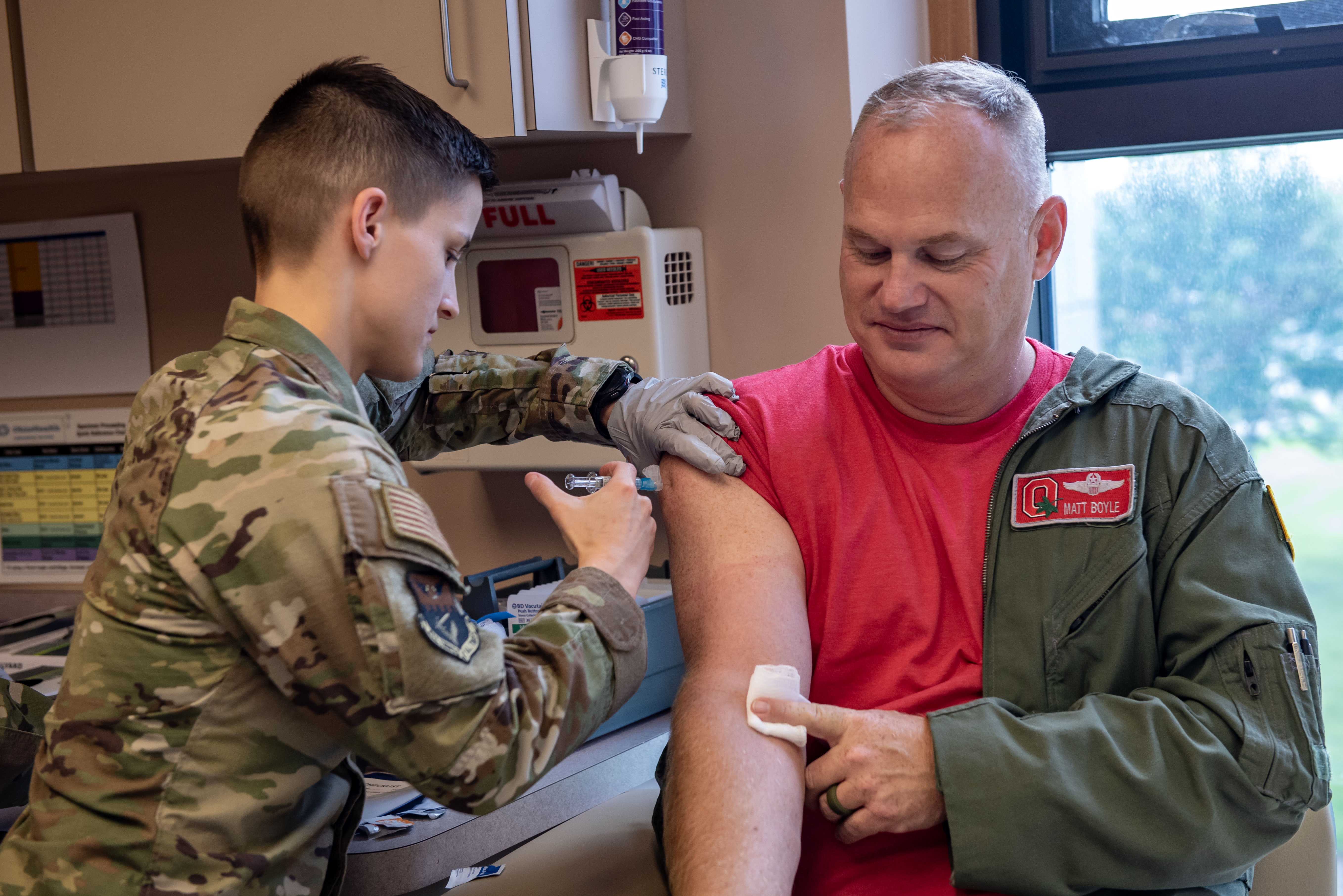 U.S. Air Force Staff Sgt. Mary Lewis with the 121st Air Refueling Wing Medical Group administers an immunization shot to Lt. Col. Matt Boyle at Rickenbacker Air National Guard Base, Ohio, May 18, 2024. Medical readiness is a critical piece of keeping Airmen healthy and prepared to complete the mission. (U.S. Air National Guard photo by Tech. Sgt. Wendy Kuhn)