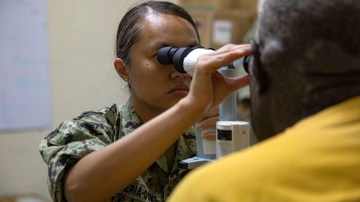 LUGANVILLE, Vanuatu (Nov. 11, 2025) – Lt. Cmdr. Gillian Claveria-Ooms performs a vision screening on a Vanuatu local at Northern Provincial Hospital in Luganville, Vanuatu, in support of Pacific Partnership 2025, Nov. 11. Now, in its 21st iteration, the Pacific Partnership series is the largest annual multinational humanitarian assistance and disaster management preparedness mission conducted in the Indo-Pacific. Pacific Partnership works collaboratively with host and partner nations to enhance regional interoperability and disaster response capabilities, increased security and stability in the region, and foster new and enduring friendships in the Indo-Pacific. (U.S. Navy photo by Mass Communication Specialist 3rd Class Ethan Lambert)