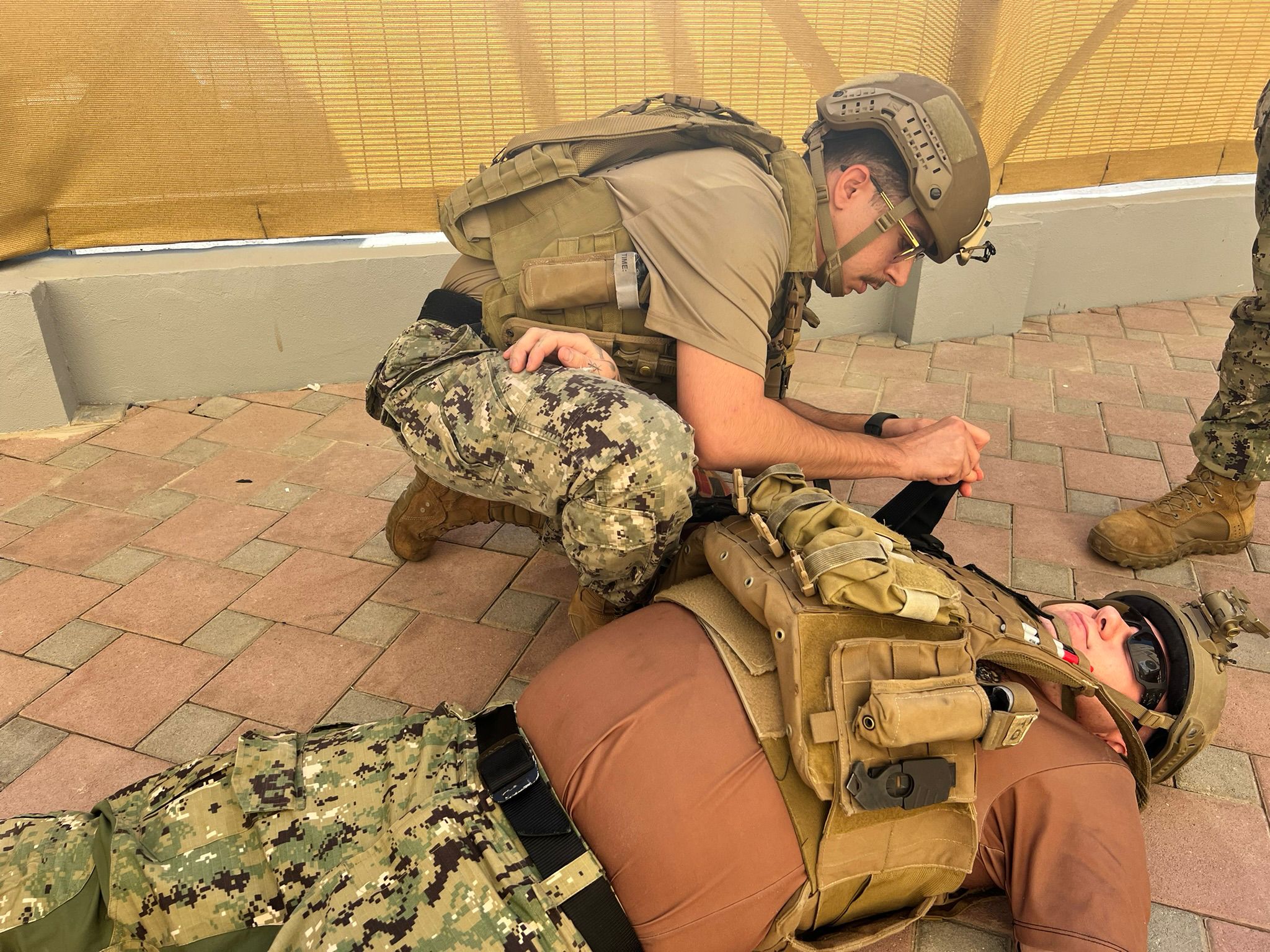 FUJAIRAH, UNITED ARAB EMIRATES (Jan. 19, 2024) Maritime Expeditionary Security Squadron (MSRON) 2 Sailor, Gunner’s Mate 2nd Class Adoriel Alamshah, treats a simulated amputation with a tourniquet during Tactical Casualty Combat Care (TCCC) Tier 1 training course while deployed in Fujairah. (U.S Navy Photo by Chief Hospital Corpsman Casey Phillips/Released)