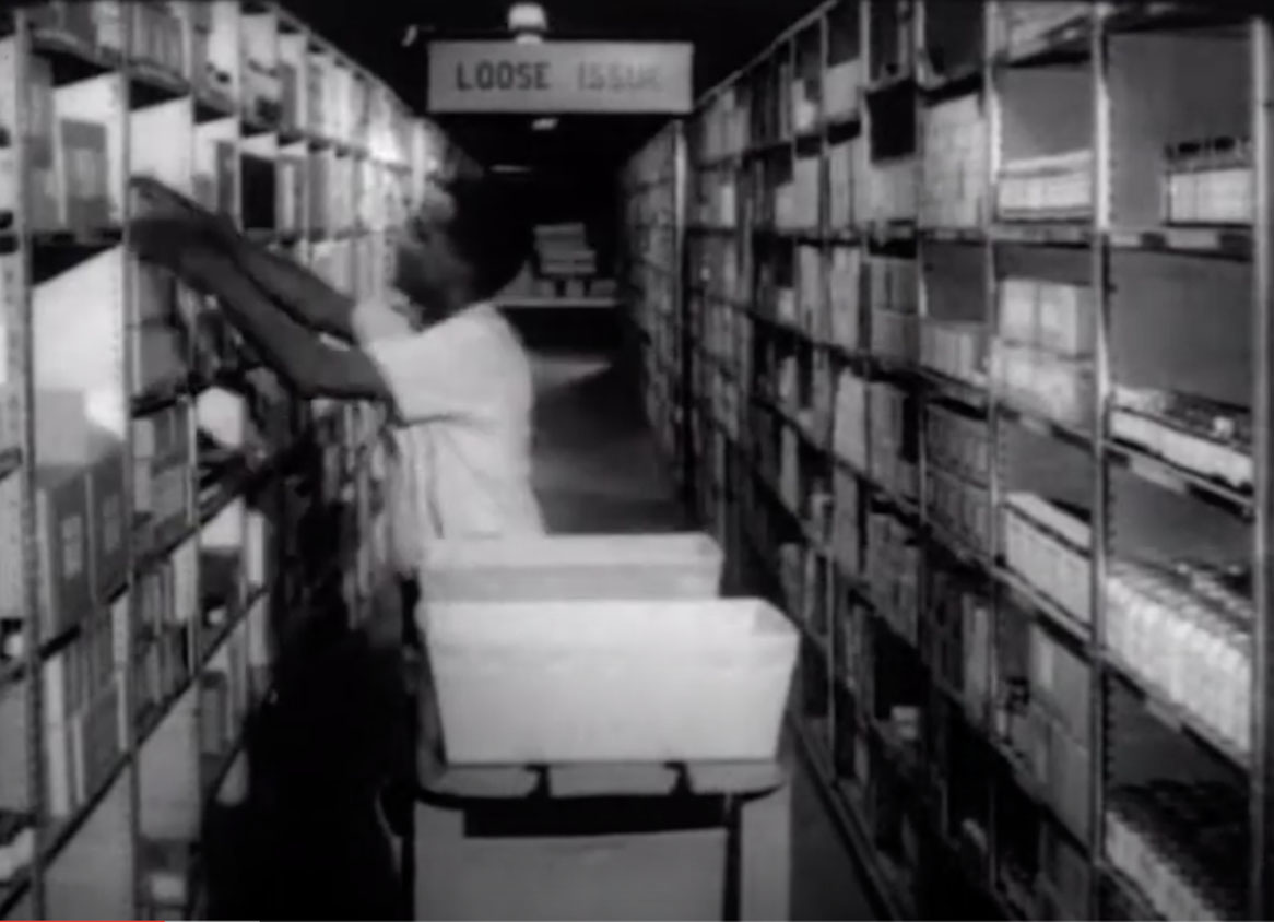 Man getting medical supplies from shelving units