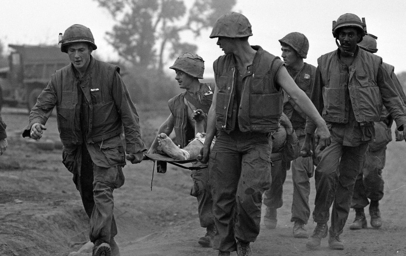 Soldiers carrying a wounded man on a stretcher