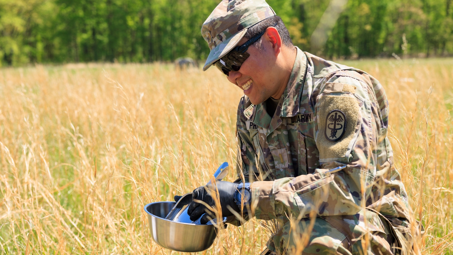 Medic tests soil samples in a field