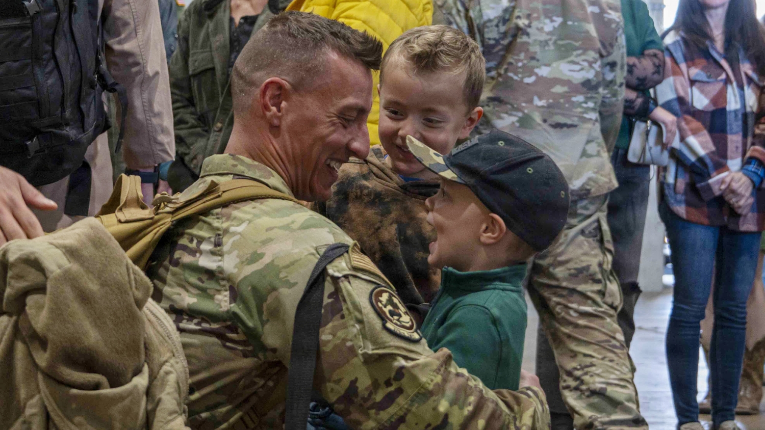 Uniformed medical professional takes a child's temperature