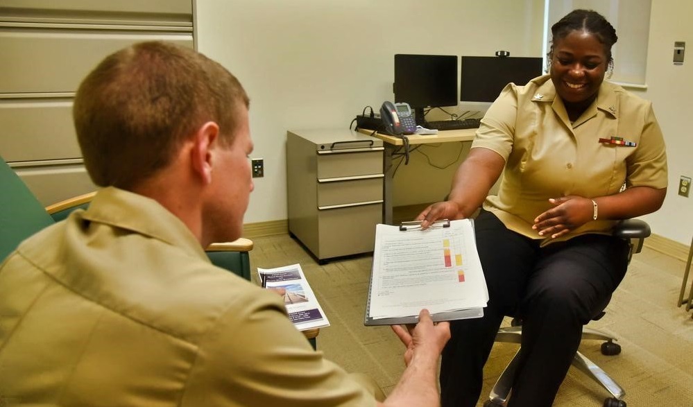 Medical personnel sharing information with Navy officer