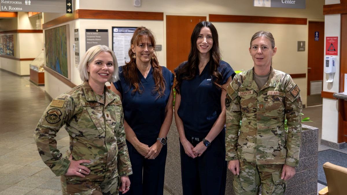 Photo By Airman 1st Class Thomas Polk | From left, U.S. Air Force Maj. Kaitlyn Bathold, 673d Surgical Operations Group certified nurse-midwife and advanced practice nurse practitioner; Cheryl Fevurly, 673d SGCG women’s health clinical nurse; Jean Walker, 673d SGCG advanced practice registered nurse and women’s health nurse practitioner; and Capt. Charlsea Thornton, 673d SGCG women’s health clinical nurse, pose for a group photo in front of the Women’s Health Center at Joint Base Elmendorf-Richardson, Alaska, Oct. 23, 2026. The Women’s Health Center provides comprehensive healthcare and midlife optimizations services to female TRICARE beneficiaries. (U.S. Air Force photo by Airman 1st Class Thomas Polk)