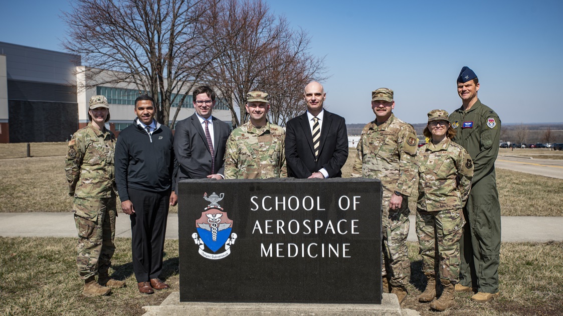 Leaders from the U.S. Air Force School of Aerospace Medicine, or USAFSAM, and Purdue University pose during a tour of several 711th Human Performance Wing facilities at Wright-Patterson Air Force Base, Ohio, March 11, 2025. USAFSAM hosted Purdue leaders in honor of a new partnership that expands educational opportunities for Airmen and Guardians. (U.S. Air Force photo / Richard Eldridge)