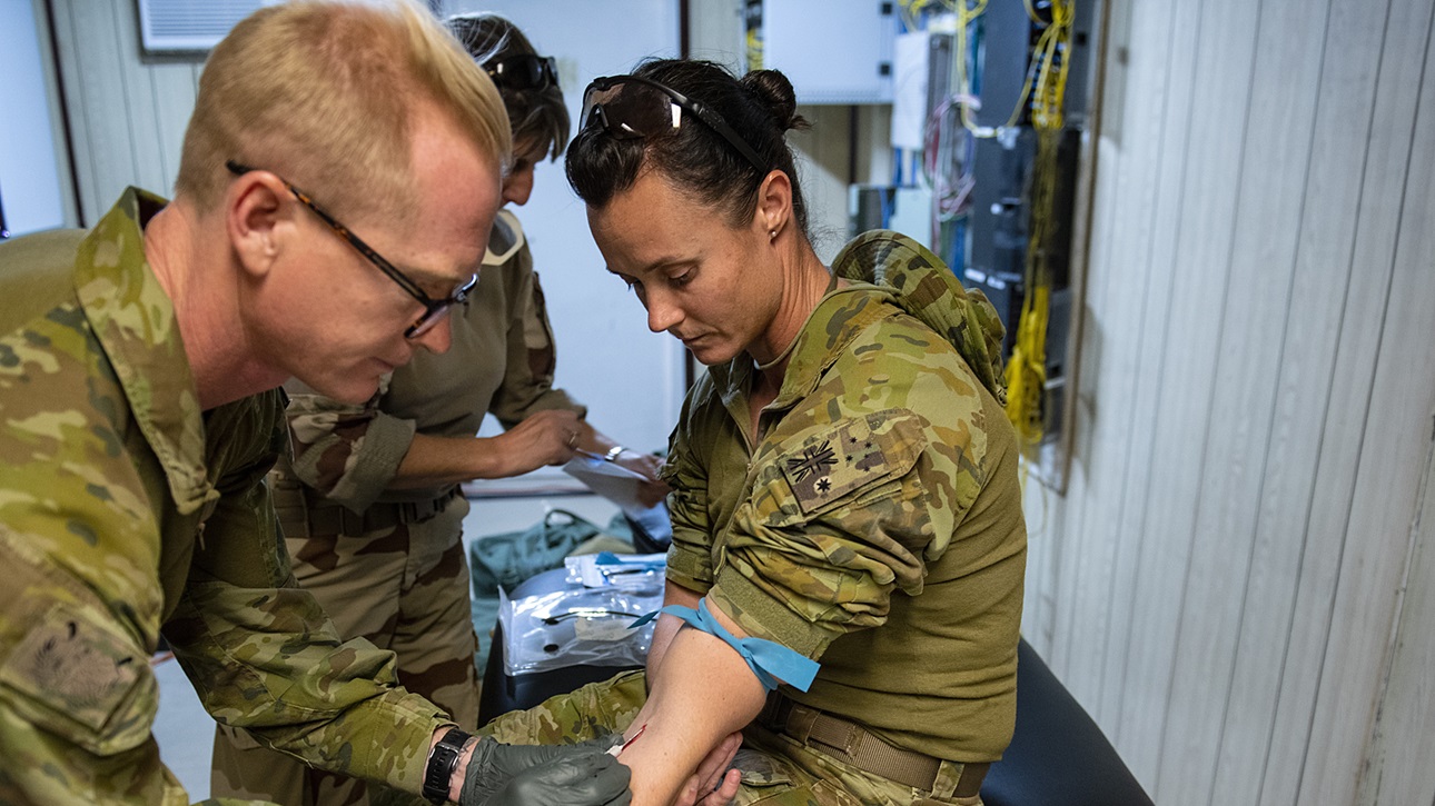 Combined Joint Task Force – Operation Inherent Resolve (CJTF-OIR) medics practice blood collection and transfusion procedures at Camp Keating, Baghdad, July 24, 2019. These medics practice on each other before going back to their respective units, and will teach the same techniques to our Iraqi partners. Multiple CJTF-OIR task forces continue to train and equip Iraqi security forces who in turn are keeping the pressure on Daesh. (U.S. Army photo by Cpt. Eric Smith).