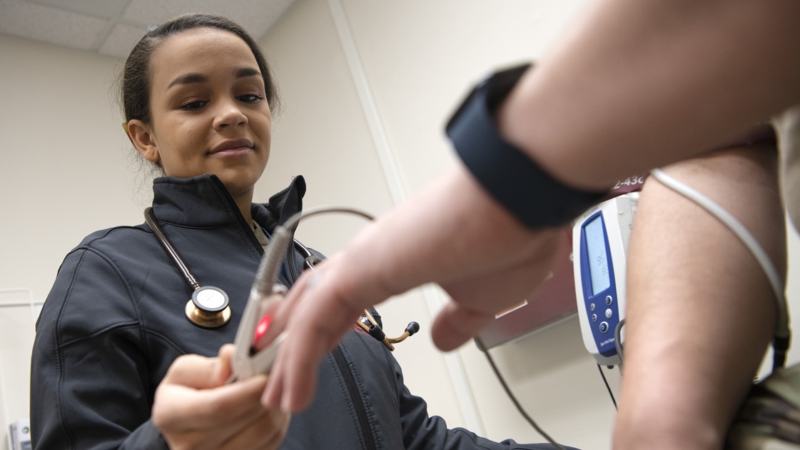 Airman 1st Class Jasmine Wilkerson, 374th Health Care Operations Squadron medical technician, checks a patient’s vitals at the Internal Medicine Clinic at Yokota Air Base, Japan