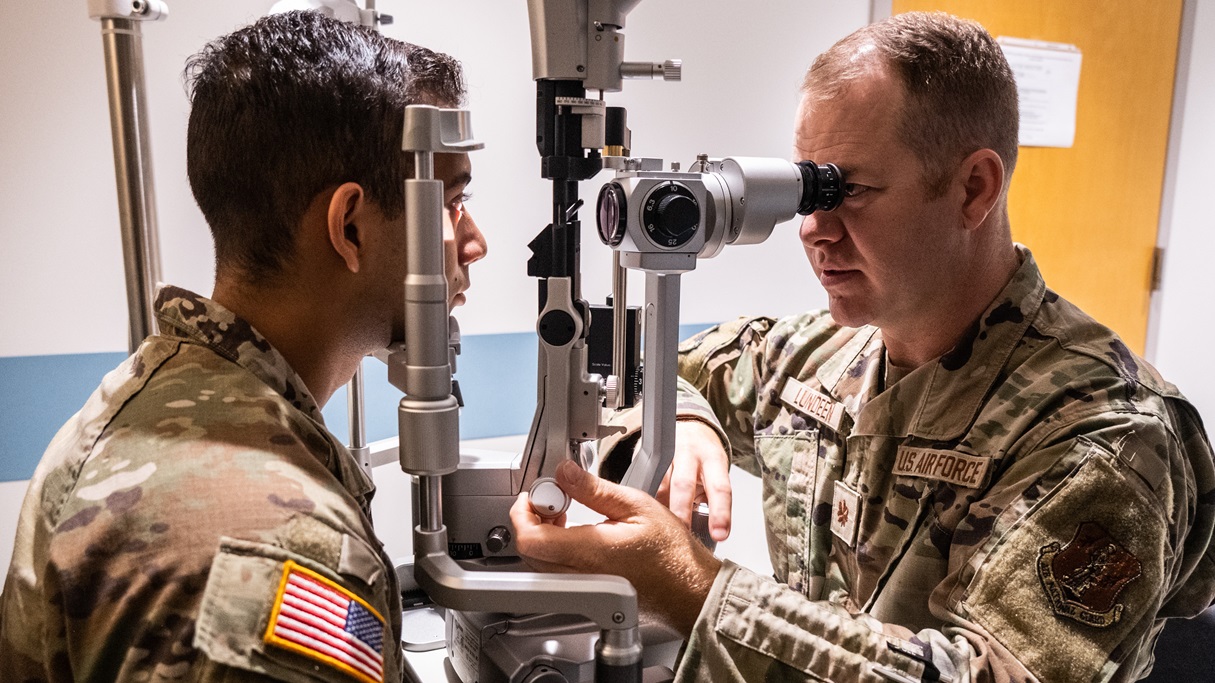 136th Medical Group Optometrist, Maj. Benjamin Lundeen checks soldiers' eyes in a routine vision test at U.S. Army Health Clinic on Schofield Barracks.