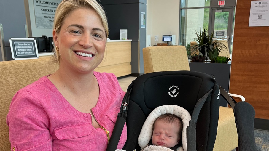 Navy Veteran Michelle Perkins holds her 12-day-old baby while attending the Baby Shower event hosted at the Chattanooga VA Outpatient Clinic on May 8, 2024. The baby shower provided essential supplies such as baby diapers, wipes, gift cards, teethers, books, soaps, and more to the pregnant Veterans. (Photo by Tracy Thomas)