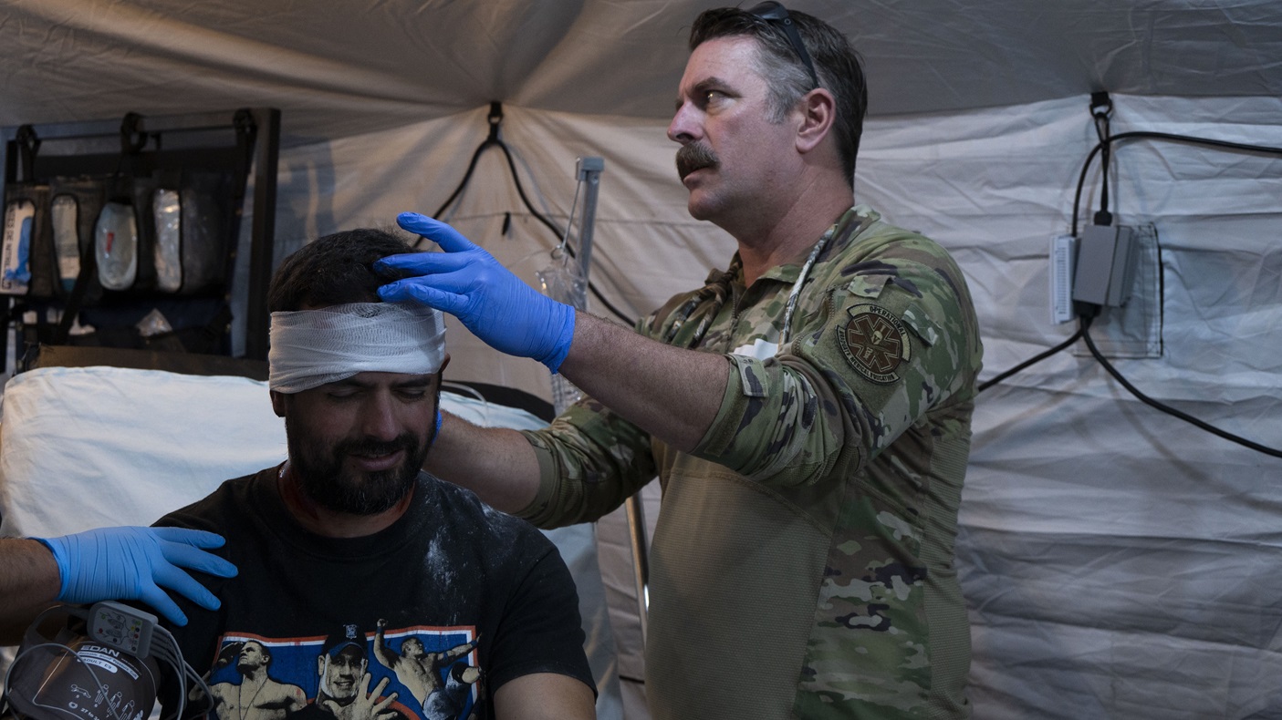 U.S. Air Force Maj. Benjamin Rud, a doctor assigned to 355th Medical Group, Davis-Monthan Air Force Base, assesses a simulated patient during CENTAM Guardian 24 Phase II at the Olympic Village recreational area, San Jose, Costa Rica