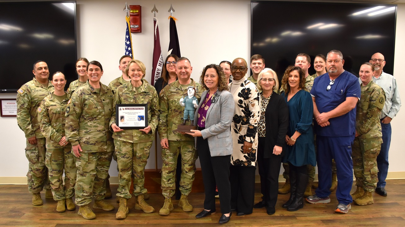 Lt. Gen. Mary Izaguirre, Army Surgeon General, and Command Sgt. Major Timothy Sprunger presented the Wolf Pack Award to Lyster Army Health Clinic's Collaboration Team for winning the coveted award for 4th Quarter, Fiscal Year 2024. The award recognizes exceptional teamwork by an integrated group of military and civilian team members focused on excellence in support of Army Medicine and was created by the Army Surgeon General and the Chief of the U.S. Army Medical Department (AMEDD) Civilian Corps.