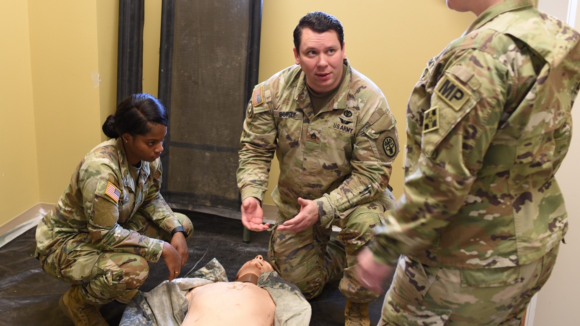 Staff Sgt. Chad Bortle, a critical care flight paramedic assigned to the Evans Army Community Hospital Department of Education, teaches emergency life-saving skills to military police from the Fort Carson Law Enforcement Activities Company, Jan. 29, 2025. EACH hosted a comprehensive cadaver training exercise Jan. 29-30, 2025, to enhance the skills of medical professionals in a realistic and immersive environment.