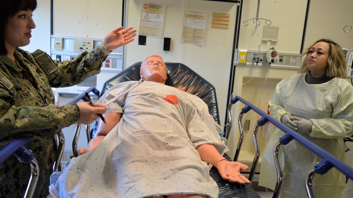 Making an inpatient point…Lt. Barbara Kent, Pediatric Clinic department head and Navy Nurse Corps officer, guides staff nurses through the What’s Wrong with the Room training module during Naval Hospital Bremerton’s Skills Fair, designed for critical multidisciplinary skill sustainment. Nurse Corps officers assigned to the main hospital, from the branch health clinics located on Naval Base Kitsap and Naval Base Everett, civilian registered nurses and hospital corpsmen were provided five training modules, Feb. 11, 2025, designed to refresh their proficiency levels which in an ambulatory care setting like NHB they might not use as much as they used to (Official Navy photo by Douglas H Stutz, NHB/NMRTC Bremerton public affairs officer).