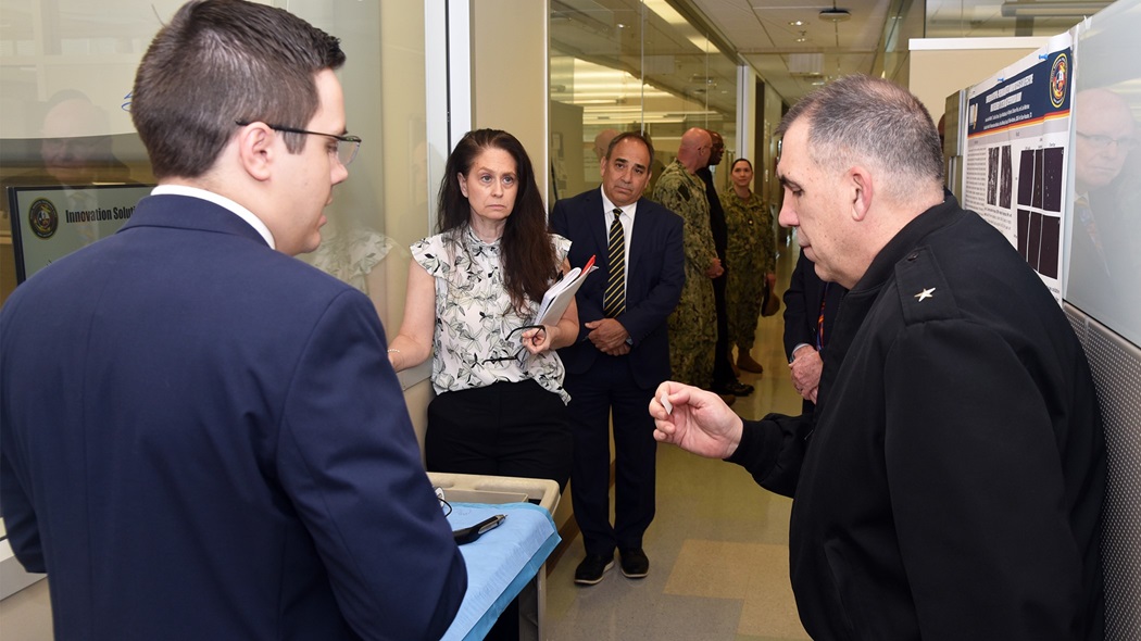 JOINT BASE SAN ANTONIO-FORT SAM HOUSTON - (Feb. 25, 2025) – Dr. Daniel Thompson (left), a research scientist assigned to Craniofacial Health and Restorative Medicine, Naval Medical Research Unit (NAMRU) San Antonio, briefs research on BoneTape implants to Rear Adm. Matthew Case, director, U.S. Navy Medical Service Corps at the Battlefield Health and Trauma Research Institute. Case, who additional serves as the director of the Navy Medical Service Corps, visited NAMRU San Antonio to better understand the unit’s mission, capabilities, and impact to Navy Medicine. NAMRU San Antonio is one of eight research laboratories within Navy Medicine Research and Development. Its mission is to conduct gap driven combat casualty care, craniofacial, and directed energy research to improve survival, operational readiness, and safety of Department of Defense personnel engaged in routine and expeditionary operations. (U.S. Navy photo by Burrell Parmer, NAMRU San Antonio Public Affairs/Released)