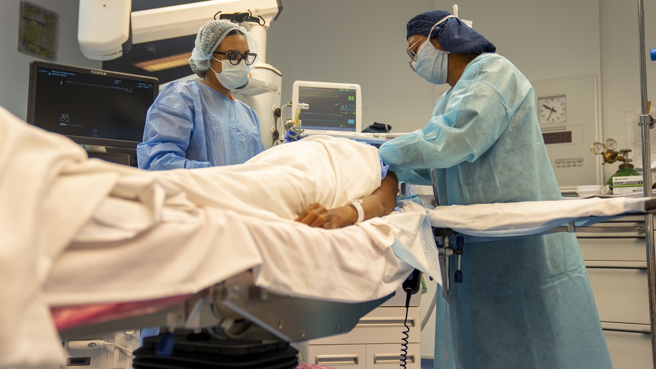 Lesser Antilles Medical Assistance Team members conduct an ultrasound-guided nerve block on a patient during the LAMAT mission at Owen King European Union Hospital in Castries, Saint Lucia, March 5, 2025. The nerve block procedure blocks pain from reaching specific nerves and can speed recovery and reduce need for post-surgery pain medication. LAMAT fosters collaboration between U.S. and host nation medical teams to facilitate knowledge sharing and skills transfer, strengthening the host nation's own healthcare capabilities. (U.S. Air Force photo by Andrea Jenkins)