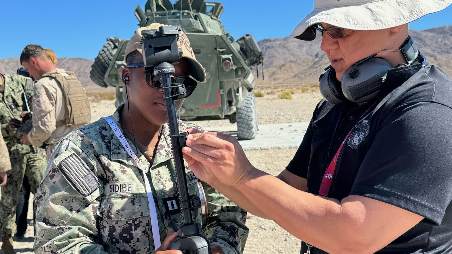 Industrial Hygienists Lt. Adiaratou Sidibe (left) from NMRTC Twentynine Palms and Kurt Bowen (right) from NMRTC Camp Pendleton conduct Blast Overpressure (BOP) sampling alongside Marines at Marine Corps Air Ground Combat Center Twentynine Palms, March 25, 2025. The joint field training allowed teams to collect real-time data on BOP exposure—an occupational hazard resulting from explosive detonations and weapons fire that can impact neurological health.