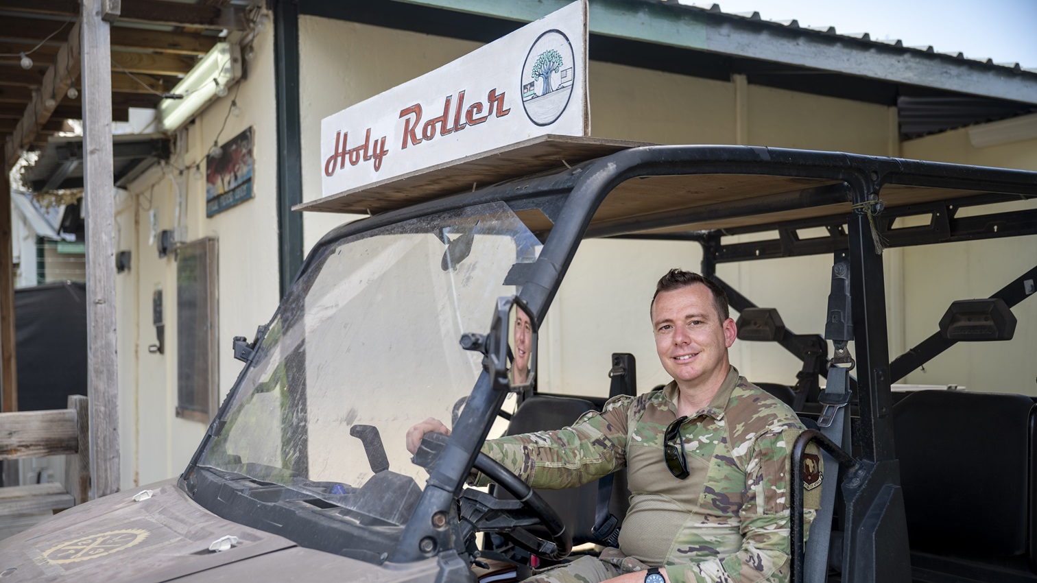 U.S. Air Force 1st Lt. Daniel Starr, 475th Expeditionary Air Base Squadron chaplain, pauses his duties to take an environmental portrait for a story about a weekly outreach initiative called Simba Cares at Camp Simba, Kenya, May 1, 2025. The program brought the chapel and behavioral health teams to soldiers stationed at remote posts around the installation. (U.S. Air Force photo by Kevin Ray J. Salvador)