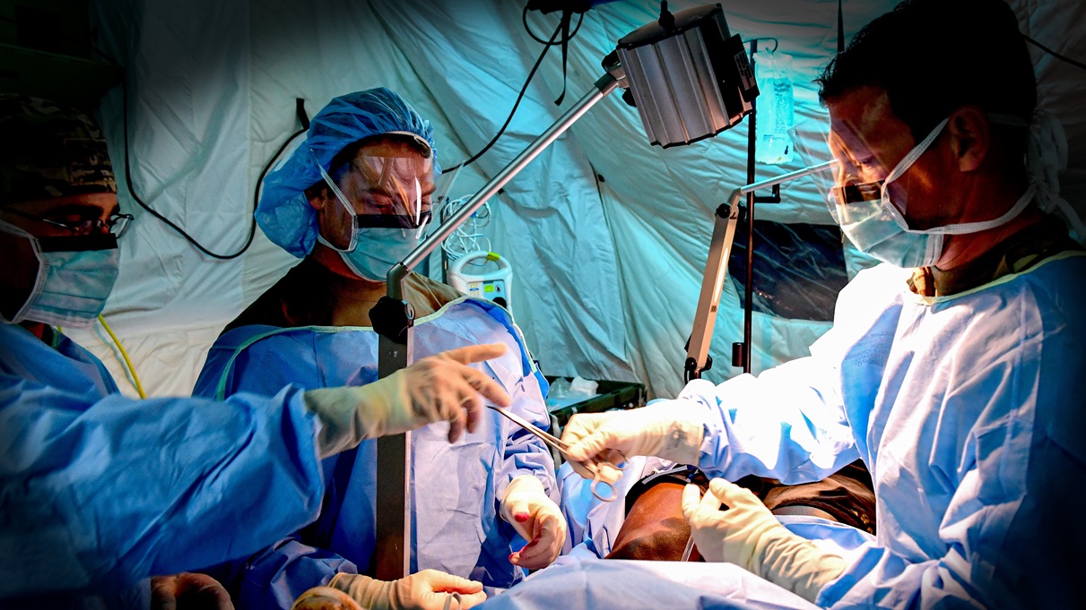 Trauma surgeons and nurses attached to the 8th Forward Resuscitation Surgical Team, 18th Medical Command (Deployment Support), perform surgery on a simulated casualty during a field training exercise on Schofield Barracks, Hawaii, February 27, 2020. The Defense Health Agency’s Operational Medical Systems Program Management Office has a robust blood products portfolio focused on far-forward, austere environments.