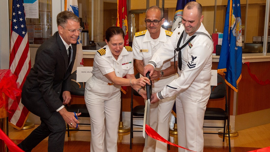 Mr. John Henley, Naval Medical Center San Diego's Inpatient Mental Health Department Head, left, Capt. Elizabeth Adriano, NMCSD's Director, center left, Rear Adm. Guido Valdes, Commander, Naval Medical Forces Pacific, center right, and Hospital Corpsman 2nd Class Matthew Stier, right, cut a ribbon during a ribbon-cutting ceremony to celebrate the completion of NMCSD's 1 West Mental Health Ward expansion.