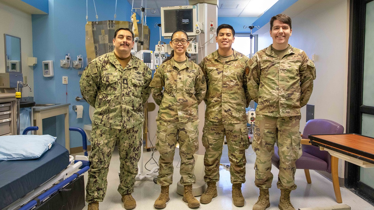 From left to right, Biomedical Technicians (BMET) Chief Eric Garcia, Sgt. Ariane Nunley, Senior Airman Victor Maldonado, and Senior Airman Brett Lucas pose for a photo after the conclusion of their annual equipment checks Jan. 29, 2025, Naval Medical Center Portsmouth, Virginia.