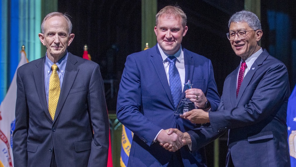 Dr. Troy Akers, a Defense Health Agency civilian employee, is presented the Hero of Military Medicine Award by Dr. David Smith, acting director, Defense Health Agency, and Joseph Caravalho, president and CEO of the Henry M. Jackson Foundation for the Advancement of Military Medicine, at an awards ceremony on May 8 at the National Cathedral in Washington D.C. The annual Heroes of Military Medicine awards recognize outstanding contributions by senior leaders, medical professionals, and civilians working in the Department of Defense.