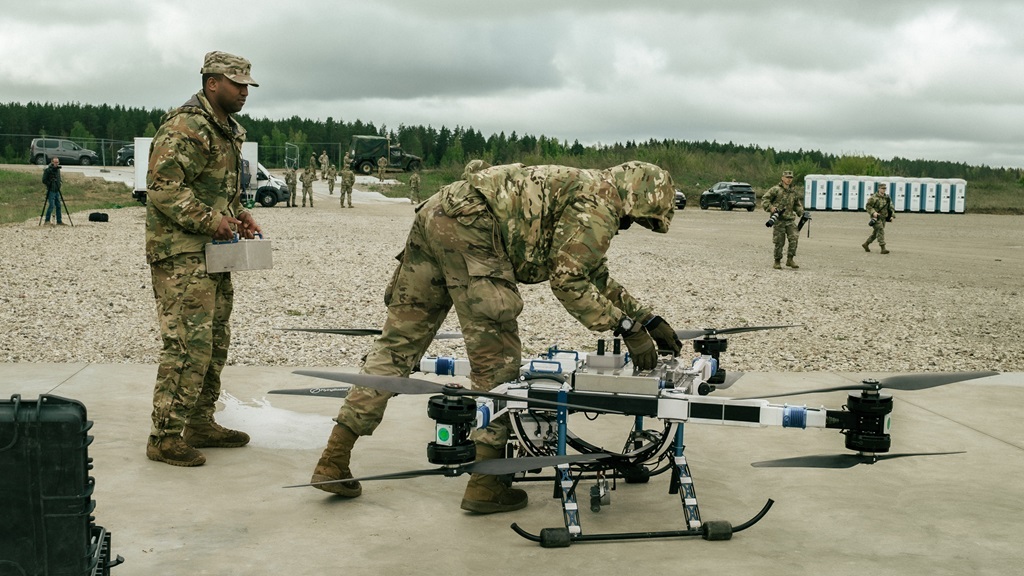 U.S. Army paratroopers assigned to the 173rd Airborne Brigade, change the batteries of the Flying basket drone alongside multinational medical teams, during a drone-based blood resupply as part of the multinational Hospital Exercise (HOSPEX) during Swift Response 2025 at Pabrade Training Area, Lithuania, May 15, 2025.