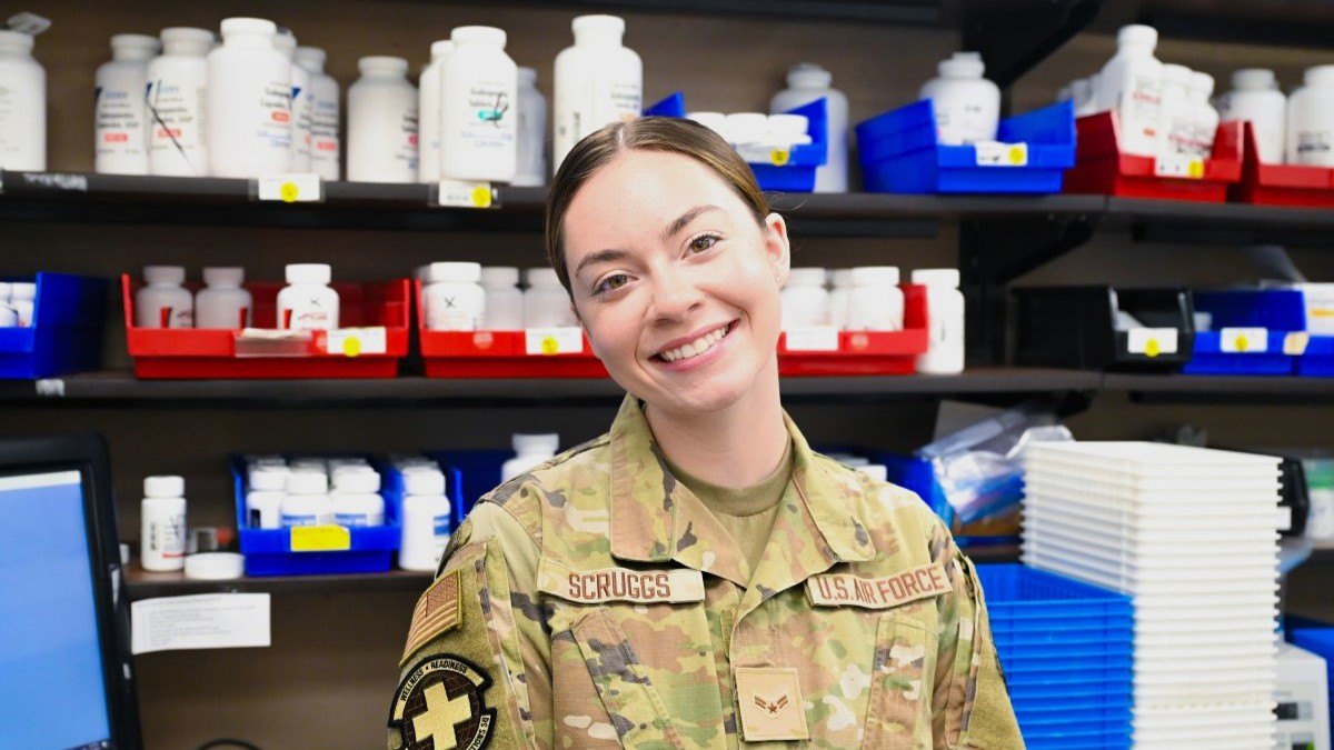 U.S. Air Force Airman 1st Class Alyssa Scruggs, 20th Medical Group pharmacy technician, poses for a Weasel of the Week portrait at Shaw Air Force Base, S.C., May 13, 2025. The Weasel of the Week program, run by 20th Fighter Wing leadership, recognizes members for their commitment, performance, and dedication to the mission. (U.S. Air Force photo by Senior Airman Mariana Tafur)