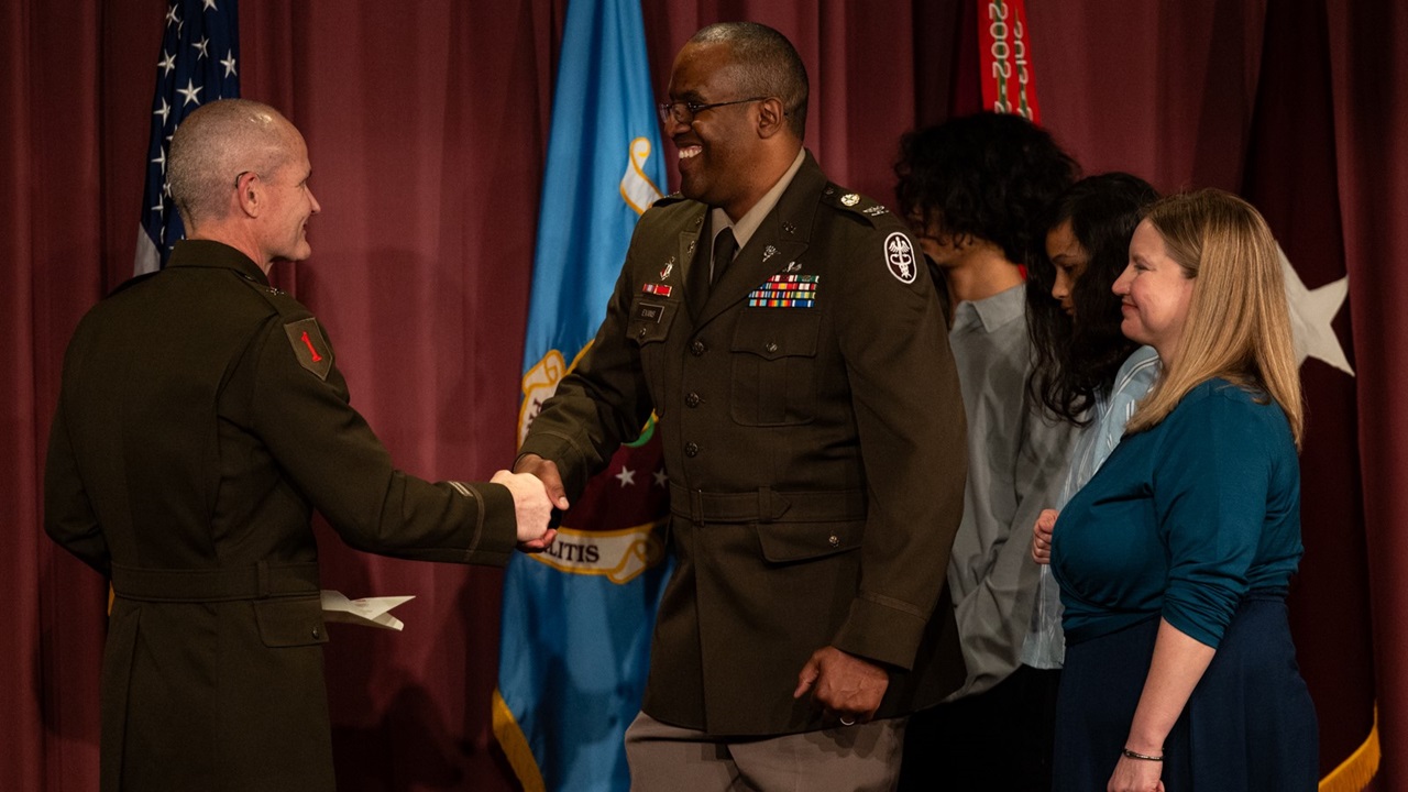 Brig. Gen. Clinton K. Murray (left) Commanding General, United States Army Medical Center of Excellence (MEDCoE) and Chief of the U.S Army Medical Corps, presided over the Promotion ceremony of BHSL Director Col. Oseola Evans (Right) with his family (PHOTO By Ryan Graham, Madigan Visual Information)