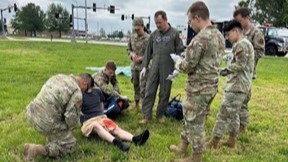 Members of the 509th Medical Group, Whiteman Air Force Base, Mo., participate in a field readiness training evolution under the watchful eye of Dr. Van Uitert, aeromedical provider. 