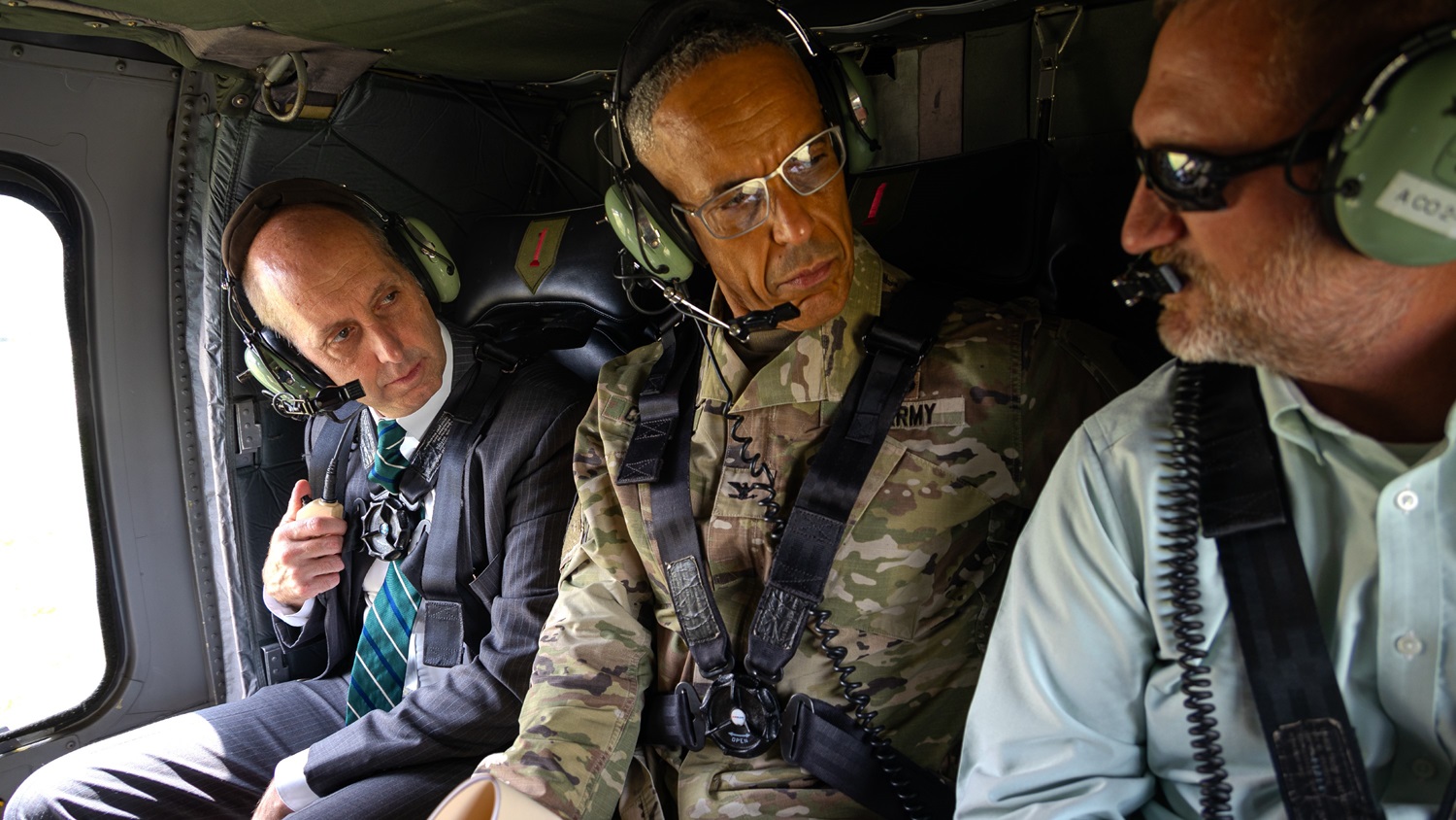 Dr. Stephen Ferrara, Acting Assistant Secretary of Defense for Health Affairs, receives an aerial tour of Fort Riley June 30, 2025, aboard a UH-60 Blackhawk, guided by Clay Nauman, Director of Plans, Training, Mobilization, and Security. 
