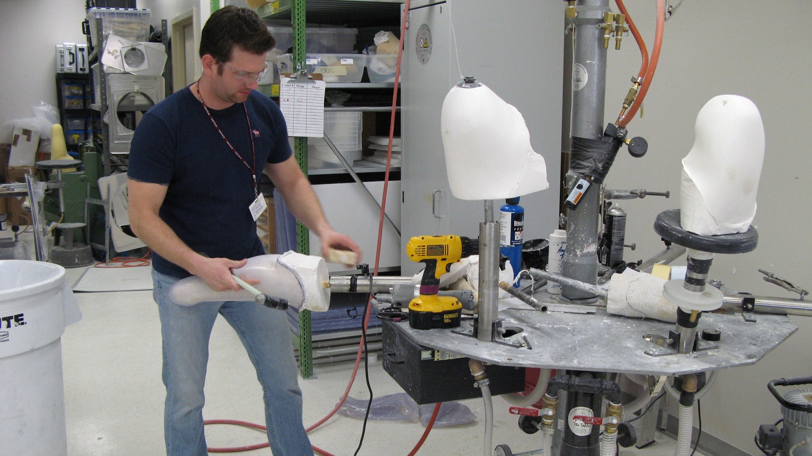 Walter Reed Army Medical Center prosthetic technician Jared Scott McClure works to remove the test socket from the plaster cast of a patient’s residual limb. How well he does his job determines the fit and function of the permanent socket, and, ultimately, how well the servicemember performs with their prosthetic. Defense Dept. photo by Fred W. Baker III