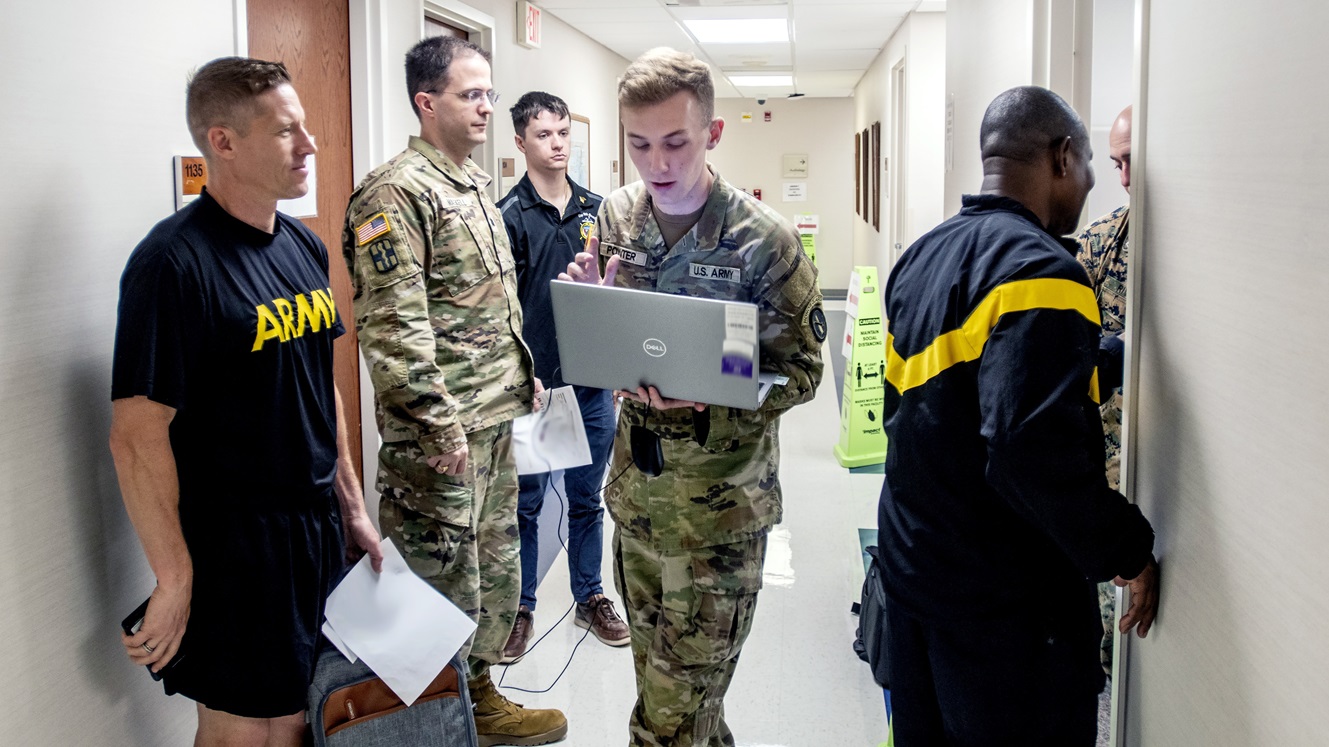 U.S. Army Pfc. Jace Poynter, a medic at Andrew Rader Army Health Clinic, Joint Base Myer-Henderson Hall, organizes medical care during a monthly health readiness rodeo at the clinic on July 18, 2025. The rodeo demonstrated the unwavering commitment of the medics, health professionals, and the Defense Health Agency to warfighter readiness.