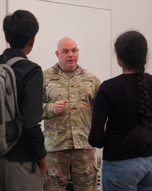 Col. Jacob Johnson, a Fellow in the U.S. Army Medical Research Institute of Infectious Diseases Biosafety and Biosecurity Program, speaks with near-peer mentors participating in the Gains in the Education of Mathematics and Science summer program at Hood College.