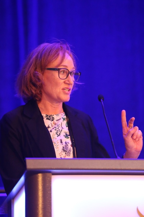 Eva Rosvold, director of the Defense Health Agency Research & Development-Medical Research and Development Command’s Experimentation Integration Cell, speaks during a panel discussion on “Positioning Innovative Products for Future Force Integration through Key Military Exercises” at the 2025 Military Health System Research Symposium in Kissimmee, Florida, in August 2025.