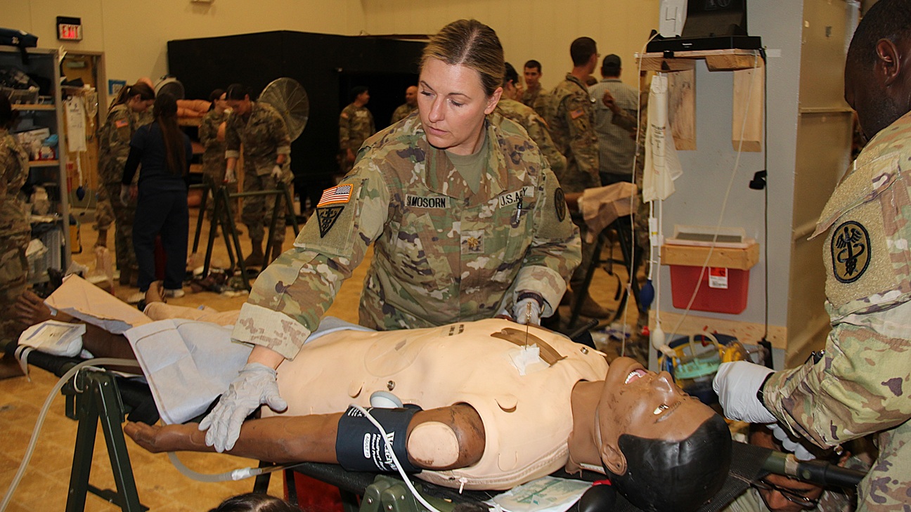 Maj. Angela Samosorn, Bassett Army Community Hospital primary care chief, assesses a simulated patient during a Medical Department Activity – Alaska mass casualty exercise August 28, 2025 in partnership with the Ft. Wainwright Medical Training Center.