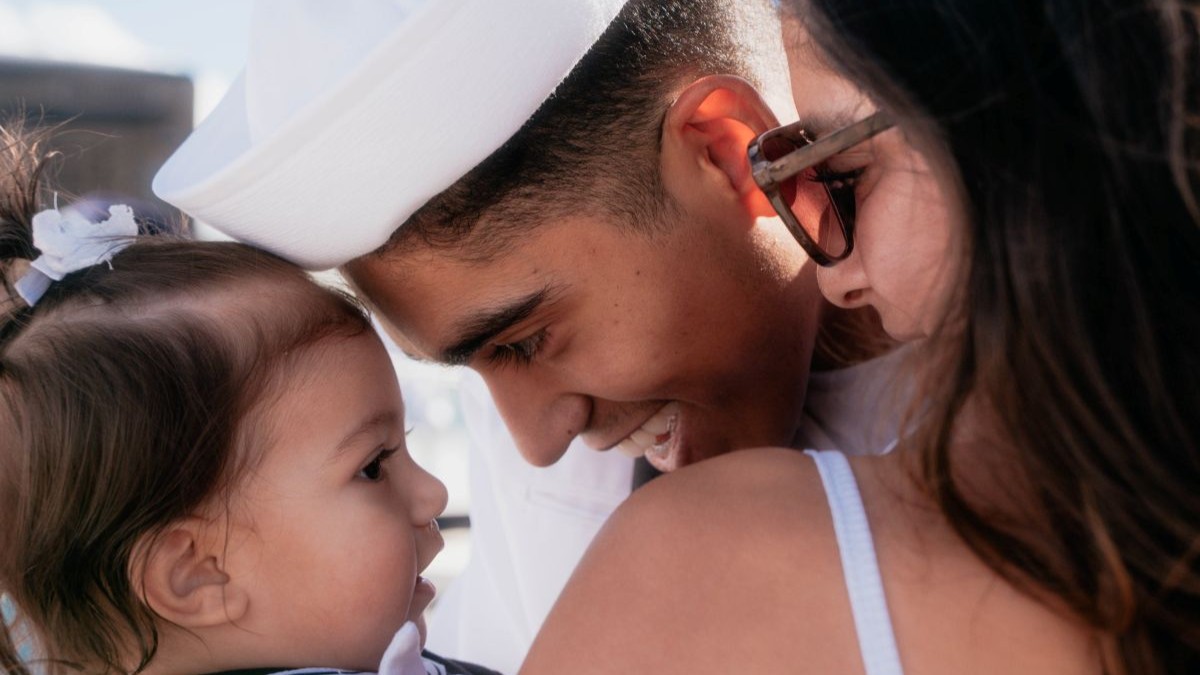 JOINT BASE PEARL HARBOR-HICKAM, Hawaii (Dec 8, 2025) - Electronics Technician (Nuclear) 2nd Class Xavier Nuñez, assigned to Virginia-class fast-attack submarine USS Hawaii (SSN 776), meets his wife and daughter pierside as Hawaii returns to its homeport at Joint Base Pearl Harbor-Hickam following a scheduled deployment, Dec. 8, 2025. Hawaii is assigned to Submarine Squadron 1 and is capable of supporting various missions, including anti-submarine warfare, anti-surface ship warfare, strike warfare, special operations forces support, and intelligence, surveillance, and reconnaissance. (U.S. Navy photo by Mass Communication Specialist 2nd Class Nicholas Russell)