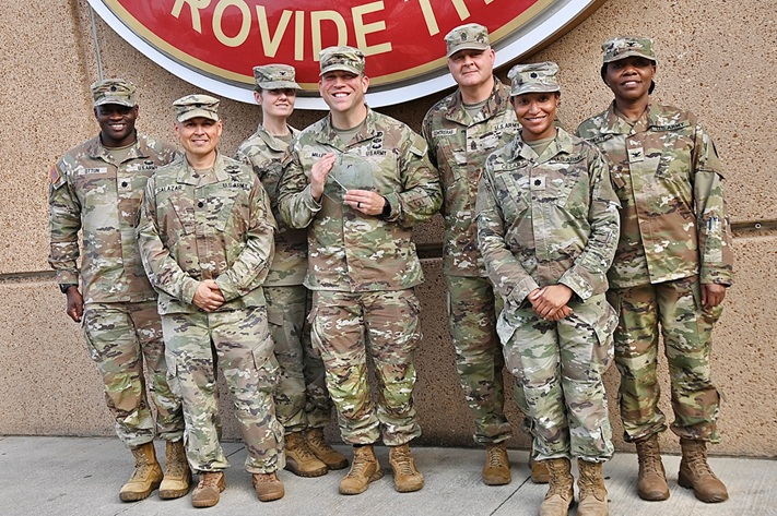 Leadership from Bayne-Jones Army Community Hospital pose with the 2025 Leapfrog Top Rural Hospital Award at the Joint Readiness Training Center and Fort Polk. Pictured from left to right are Lt. Col. Riliwan O. Ottun, deputy commander for administration; Lt. Col. Ralph T. Salazar, deputy commander for quality and safety; Col. Suzanne L. Jones, deputy commander for dental operations; Col. Patrick W. Miller, hospital commander; Command Sgt. Maj. Victor M. Contreras Jr., senior enlisted advisor; Lt. Col. Ashley D. Cesar, deputy commander for clinical services; and Col. Idongesit Ebeute, deputy commander for nursing. BJACH earned the national recognition for the fourth consecutive year, reflecting sustained excellence in patient safety and quality of care. (U.S. Army photo)