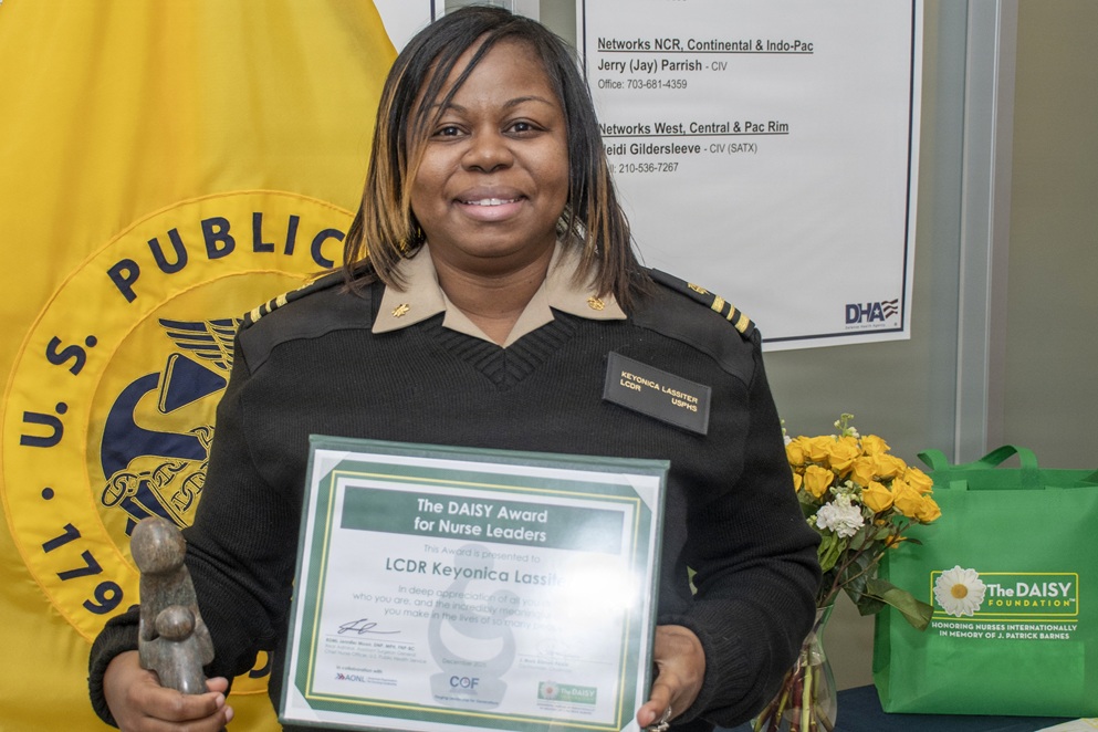 Lt. Cmdr. Keyonica Lassiter, with the U.S. Public Health Service and Defense Health Agency’s Capability Requirements Management Division, is the recipient of a DAISY Award for Extraordinary Nurse Leaders during a ceremony Dec. 11 at Defense Health Headquarters in Falls Church, Virginia. This national recognition celebrates nurses who pair clinical excellence with compassion and strong leadership.