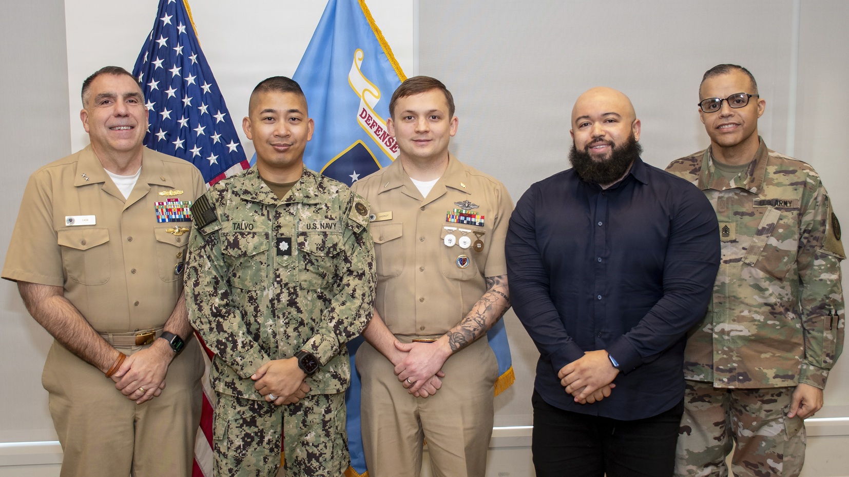 Rear Adm. Matthew Case, Defense Health Agency acting deputy director, and Sgt. Maj. Manuel Cruz, DHA senior enlisted leader, health care administration, host an employee recognition ceremony January 20 at Defense Health Headquarters in Falls Church, Virginia. Honorees included Cmdr. Raben Talvo, Lt. j.g. Brandon Andriot, and Sven Perryman.