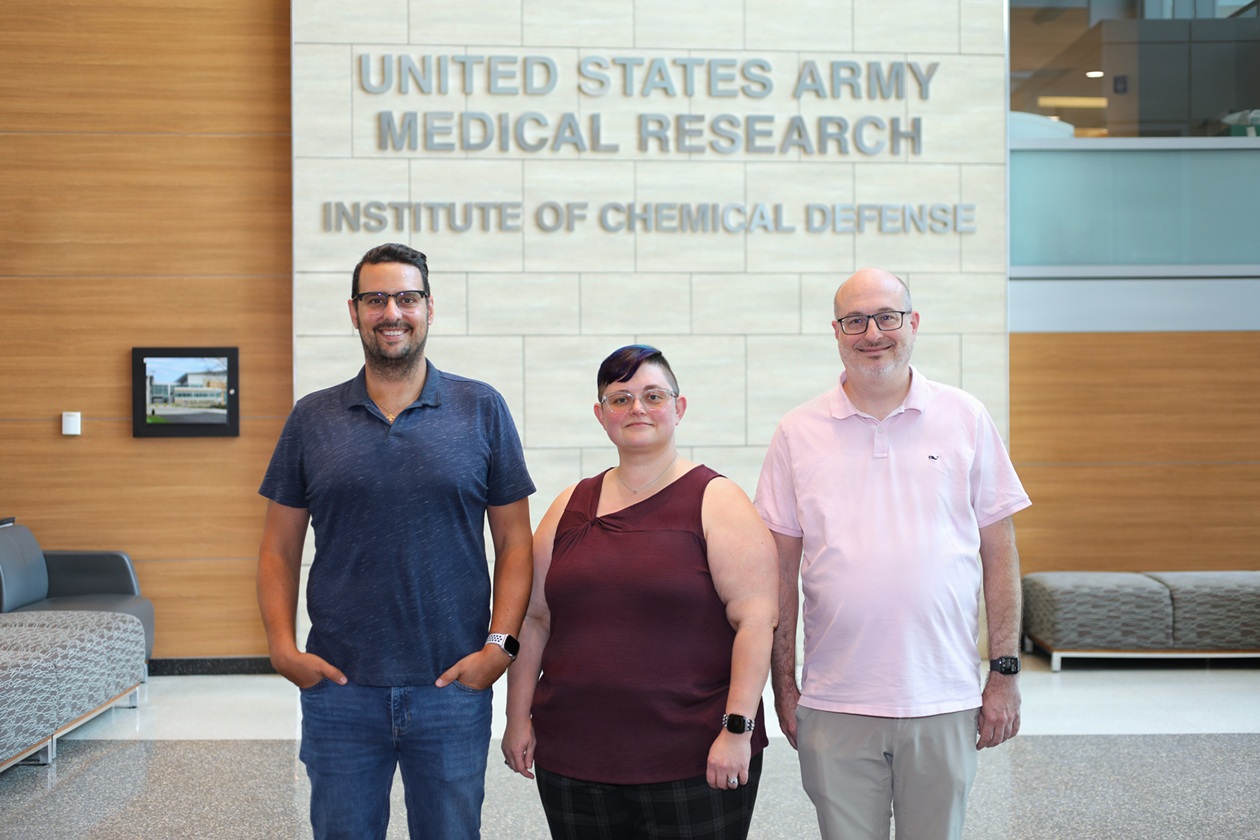 Dr. C. Linn Cadieux, center, a research chemist with the U.S. Army Medical Research Institute of Chemical Defense Medical Toxicology Research Division, led the development of a new model for testing nerve agent exposure and drug efficacy that promises to accelerate the fielding of the next generation of nerve agent countermeasures. Dr. Nicholas Paparoidamis, left, and Dr. Robert diTargiani oversaw the development of crucial elements of the model that ensured its success. (photo credit: USAMRICD Visual Information Office)