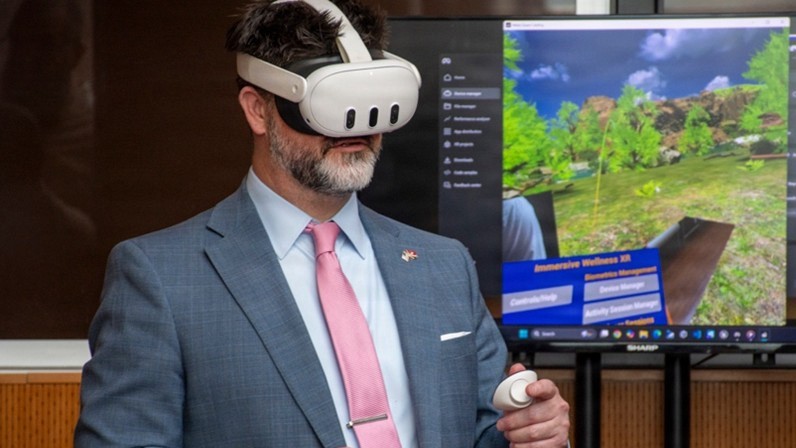 James Perkins, acting program executive officer for the Defense Healthcare Management Systems, is given a demonstration of a virtual reality technology program during the joint Veterans Health Administration and Defense Health Agency’s Immersive Health Care Technology Demo Day at the Washington VA Medical Center in Washington, D.C. The event provided veterans, service members, clinicians, and agency leaders with an opportunity to try technology designed to treat veterans and service members with a range of healthcare issues.