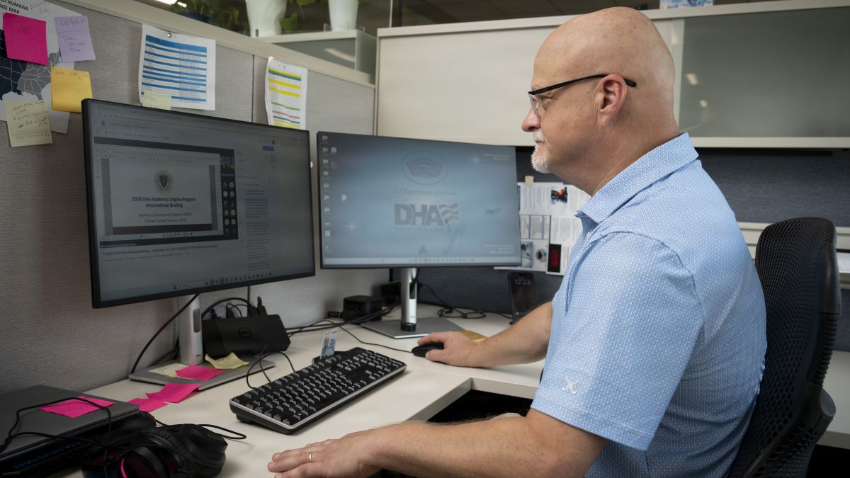 Jason Wagner, Defense Health Network Central chief of Patient Administration, browses the Defense Health Agency’s Workforce Development website at DHN Central, San Antonio, Texas, Aug. 4, 2026. Professional growth of civilian employees is a top priority for DHA and DHN Central leadership. (DoW photo by Jason W. Edwards)