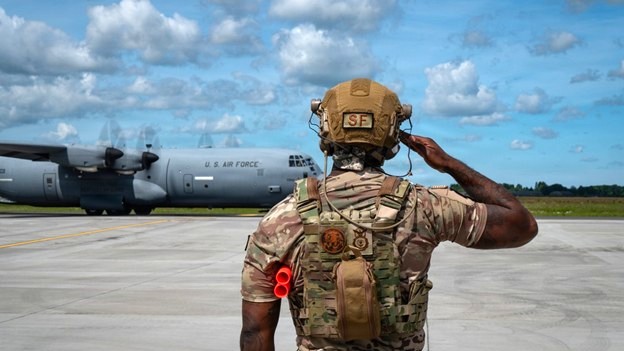 A U.S. Air Force technical sergeant, 172nd Airlift Wing, marshals an aircraft at Karup Air Base, Denmark, June 18, 2026. The wing was recognized as one of 13 military programs for their commitment and innovation in outstanding suicide prevention efforts to save lives at the 2026 Suicide Prevention Recognition Ceremony Sept. 2 at the Pentagon, presented by Defense Suicide Prevention Office. The programs’ “efforts and resourcefulness create changes that will leave a positive impact on military members and their families,” said Dr. Alicia Matteson, acting director of DSPO. (Photo by Master Sgt. Sarah McClanahan)